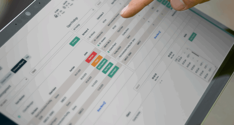 Person taps tablet screen, interacting with a scheduling app.