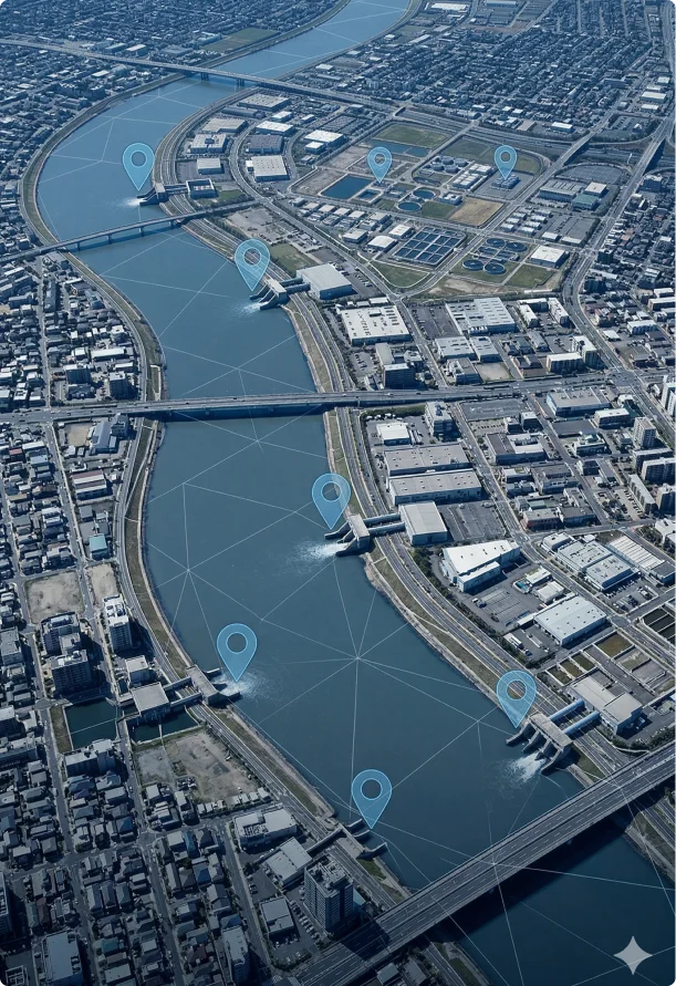 Aerial view of a city with a winding river. Several blue location pins are positioned along the river, connected by lines, suggesting a network.